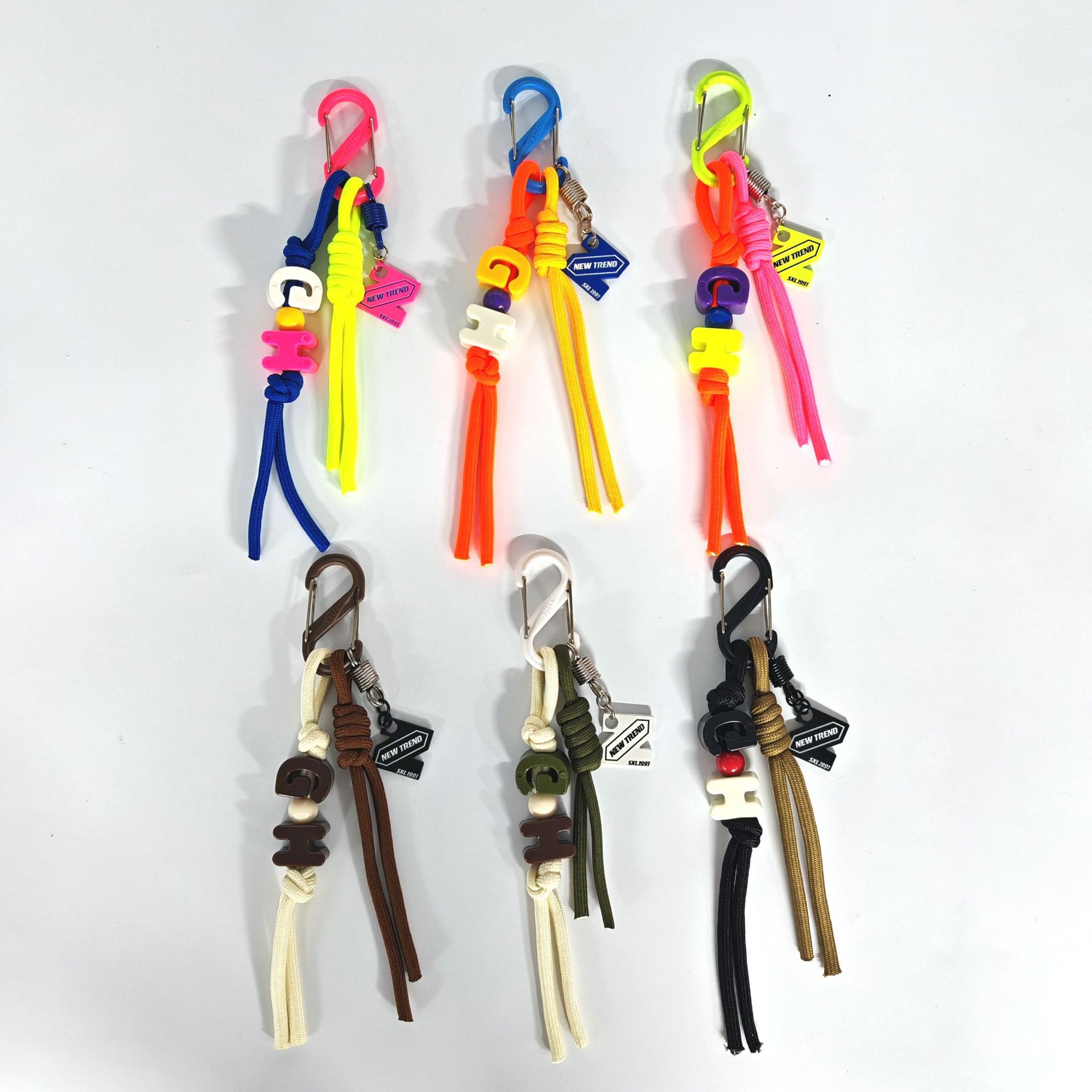 Paracord knot charm decorated with letter beads