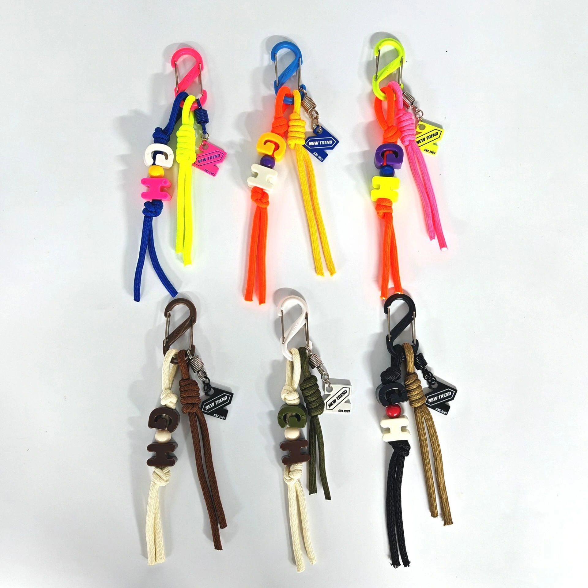 Paracord knot charm decorated with letter beads