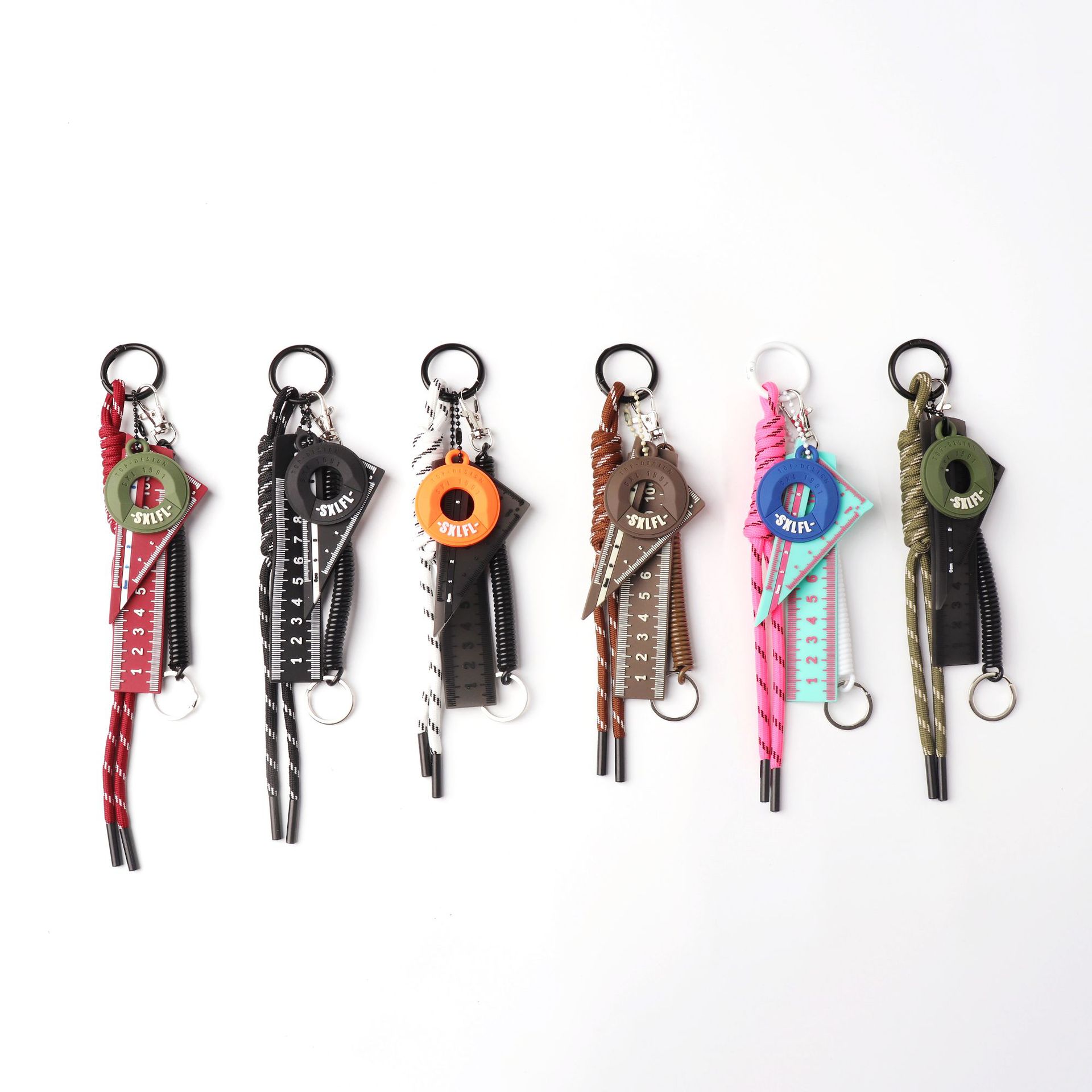 Ruler-theme paracord charm with a coil spring link