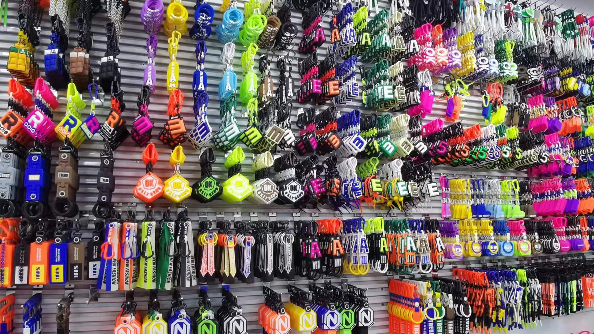 Showroom wall display of assorted PVC keychain charm styles