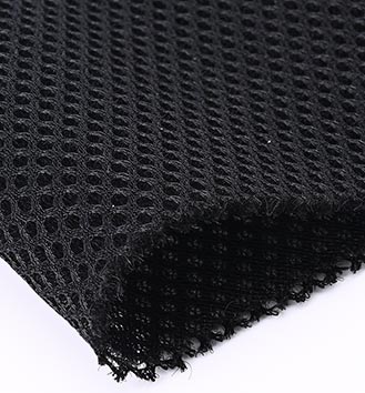 Resilient sandwich mesh fabric after compression showing thickness retention