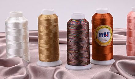 Threading the Needle of Choice: Polyester vs Rayon Embroidery Thread